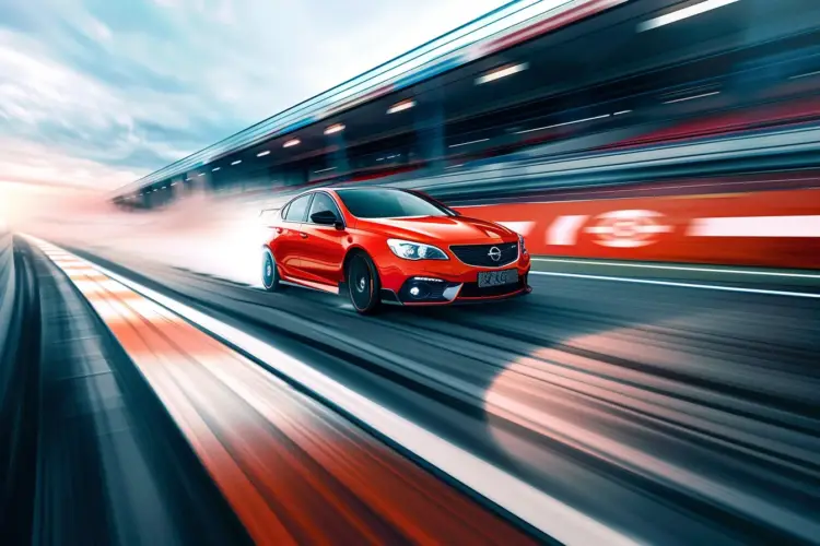A Vauxhall VXR accelerating on a racetrack, showcasing its impressive 0-60 mph time.