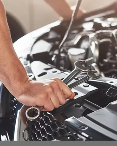 mechanic servicing an engine